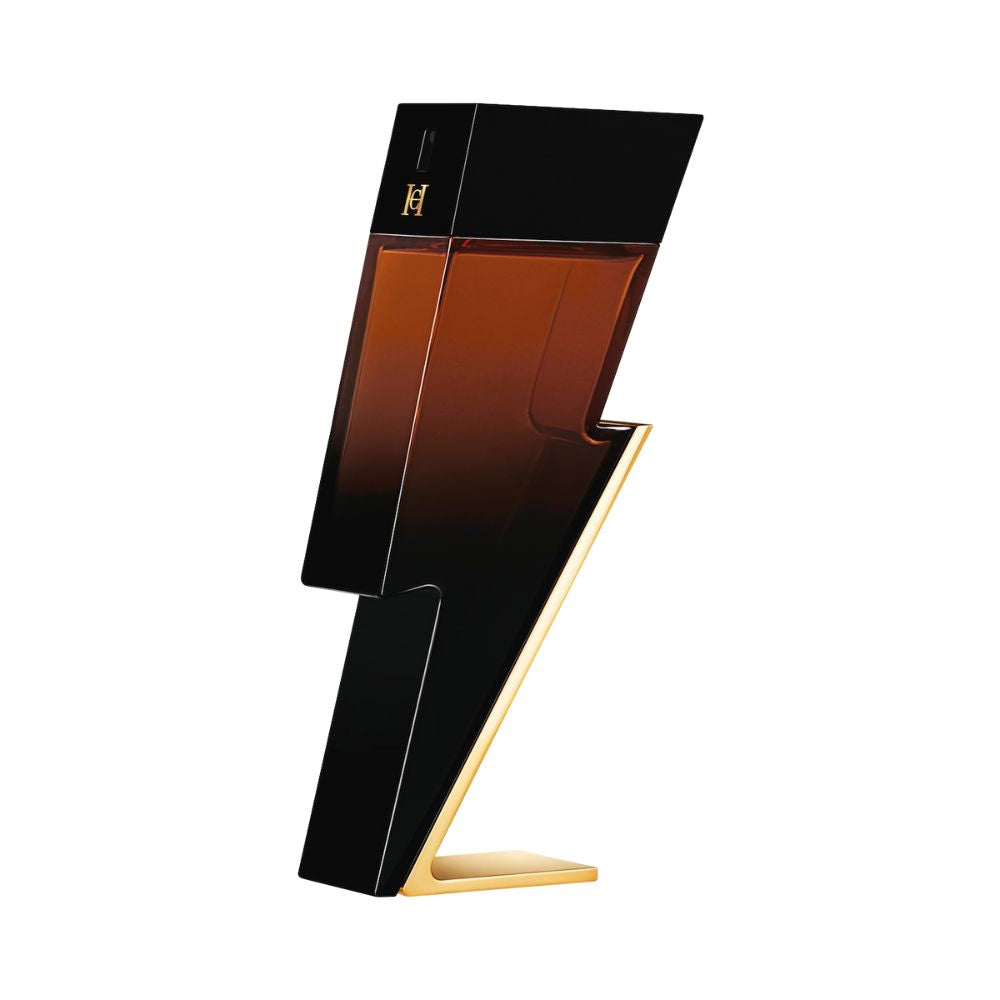 A lightning bolt shaped bottle of Bad Boy Elixir fragrance with a black and amber gradient.