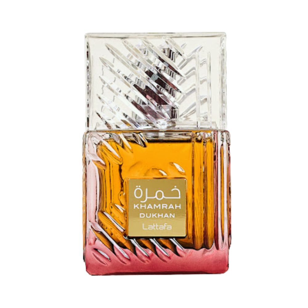 A bottle of Lattafa Khamrah Dukhan perfume with a textured glass design and amber-colored liquid.