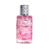 Dior JOY Eau de Parfum Intense perfume bottle with pink liquid and silver cap.
