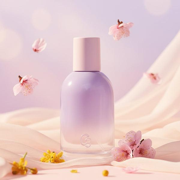 Glossier You Fleur perfume bottle with a lavender gradient and a pink cap.