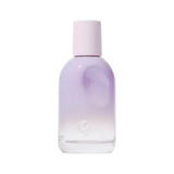 Glossier You Fleur perfume bottle with a lavender gradient and a pink cap.