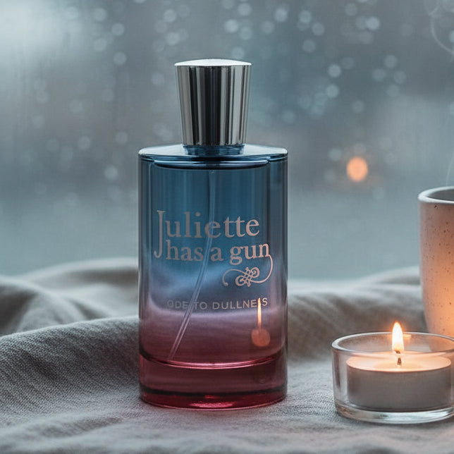 Juliette Has A Gun Ode to Dullness perfume bottle with blue and red gradient glass.