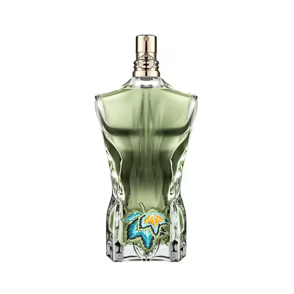 Le Beau Paradise Garden bottle with green liquid and a blue and orange leaf design.